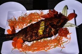 Grilled fish plated at the hotel restaurant